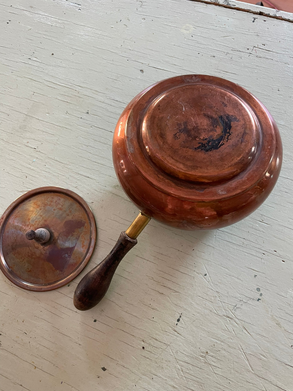 Vintage copper pot with wooden handle and lid