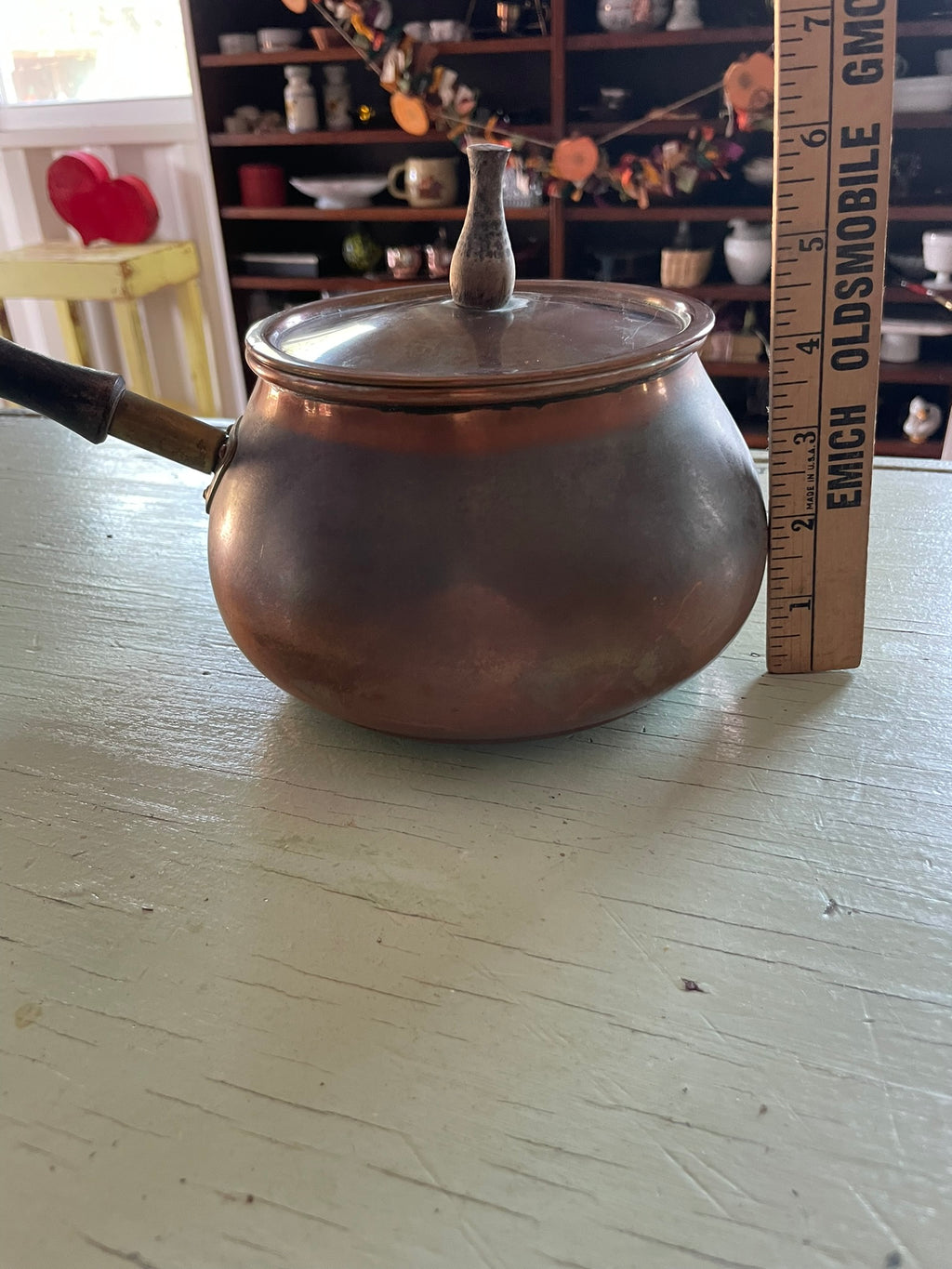 Vintage copper pot with wooden handle and lid