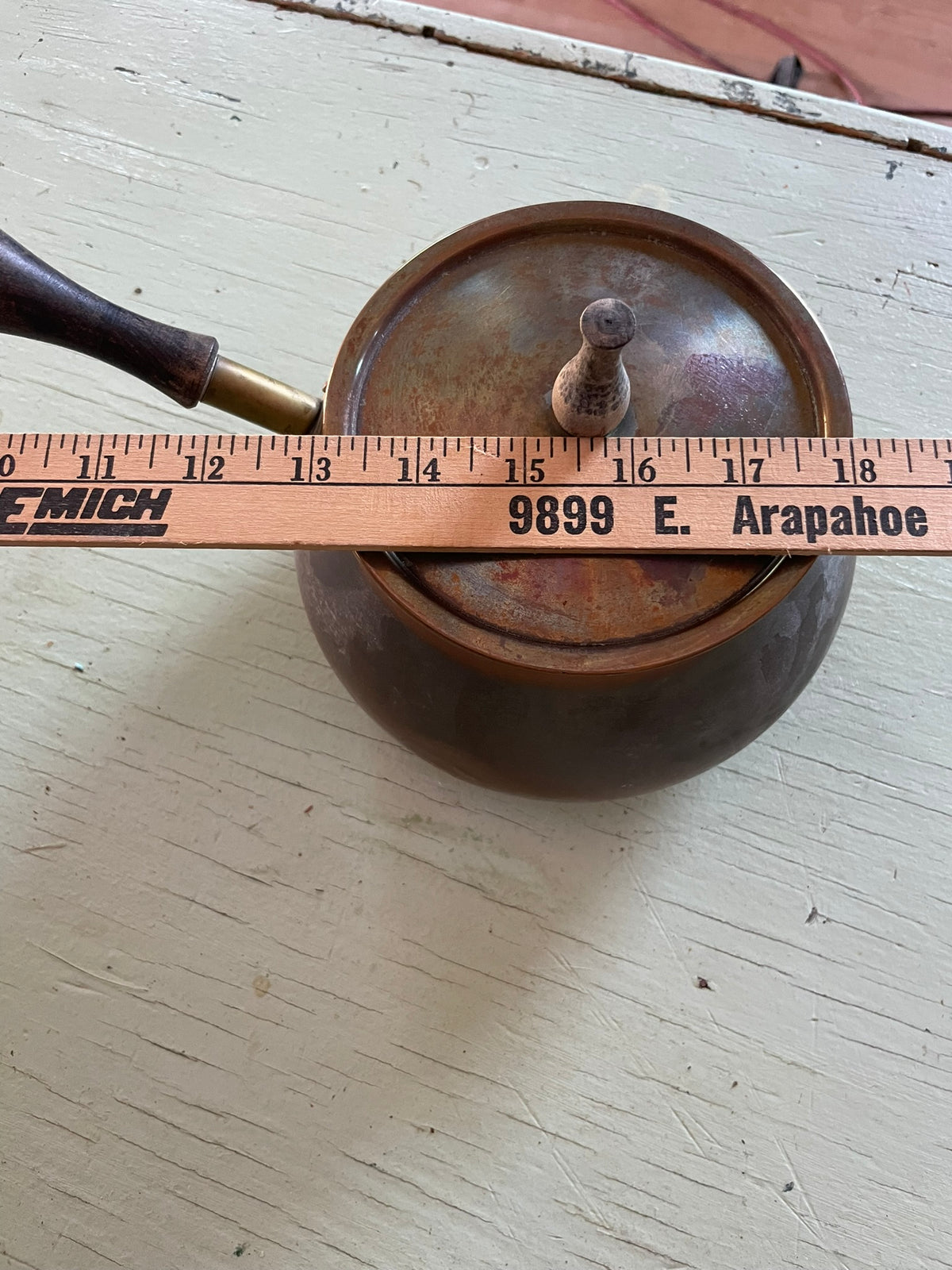 Vintage copper pot with wooden handle and lid